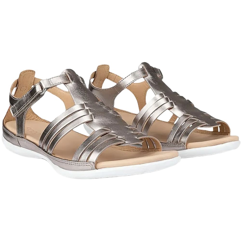 A pair of metallic pale gold leather strappy sandals with adjustable ankle straps and a white sole, shown against a plain white background.