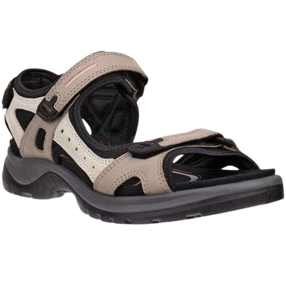A single women's offroad sandal in beige and black, featuring two adjustable Velcro straps and a rugged sole, shown on a plain white background.