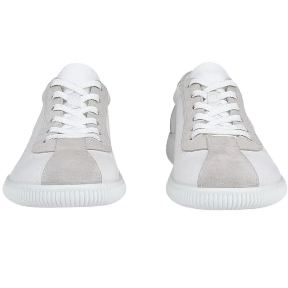 A pair of low-top sneakers shown from the front on a plain white background. The shoes feature white uppers with light gray suede panels on the toe and around the eyelets, white laces, and white ribbed soles.