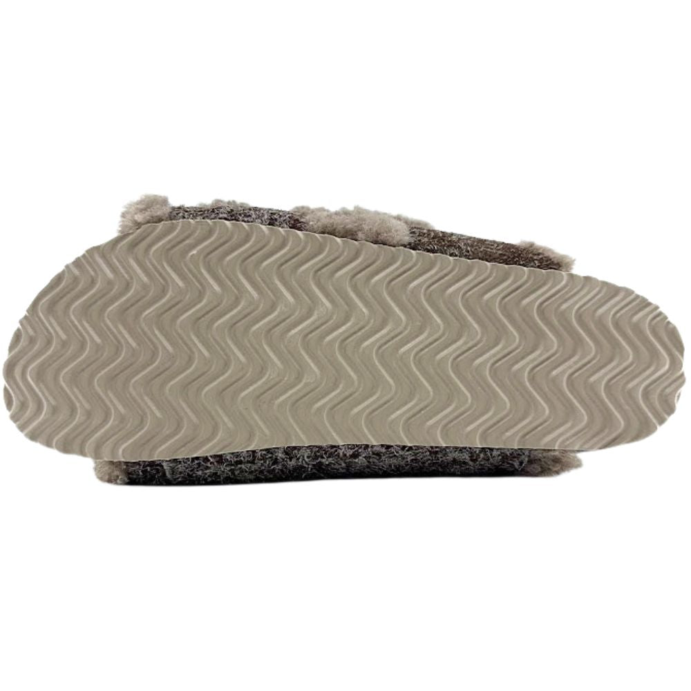 Close-up of outsole of slide with textured sole on a white background