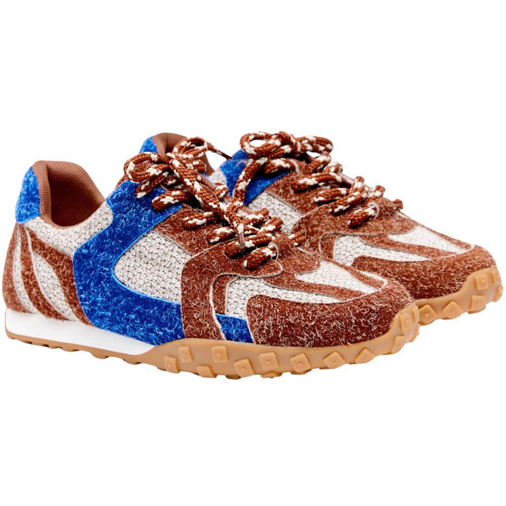Multicolored sneaker with brown, blue, and white design on a white background