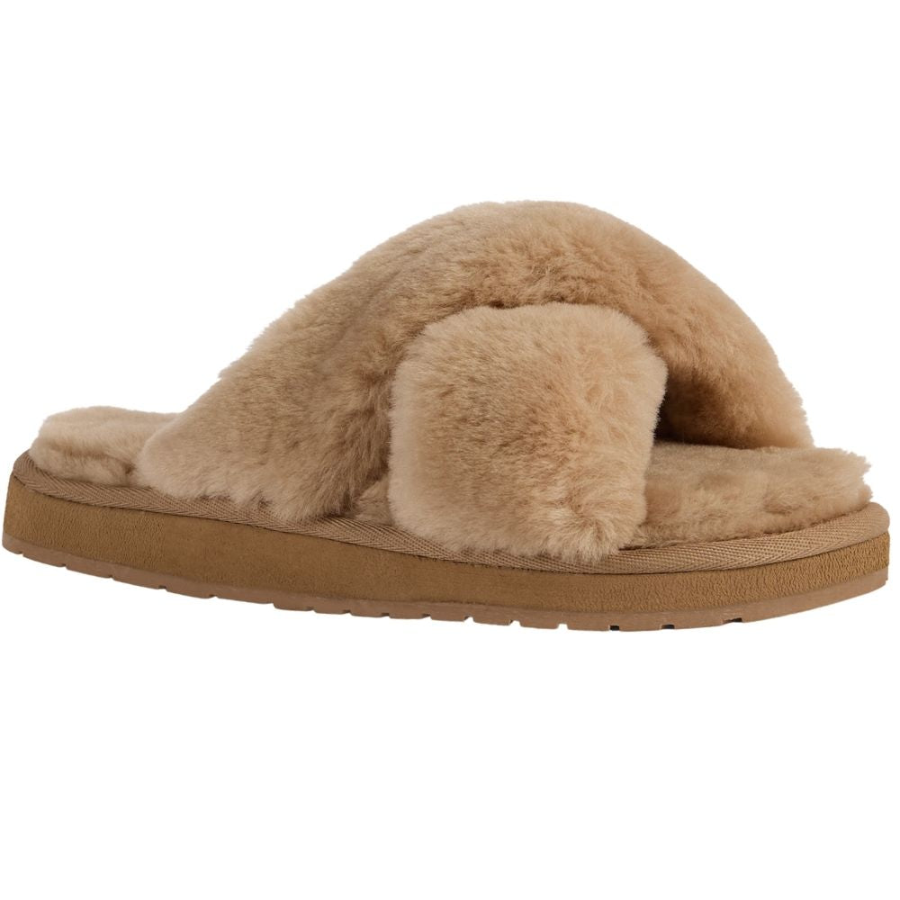 A single sheepskin slide slipper in a warm camel color, shown from a side profile view against a plain white background.