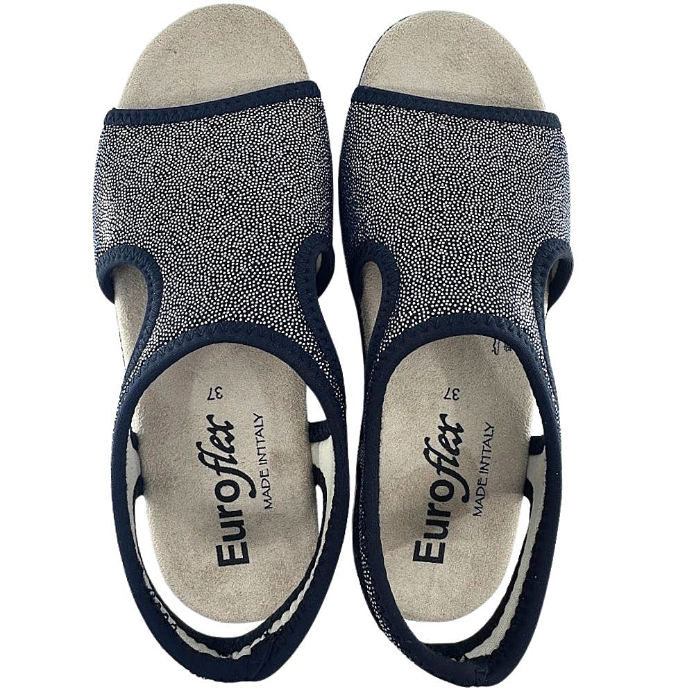 Pair of black sandals with glittery texture and 'Euroflex' branding on a white background