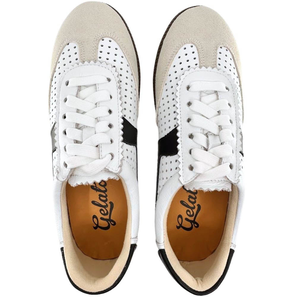 Top-down view of a pair of sneakers showing beige suede leather and white perforated leather panels with black accents, against a white background.