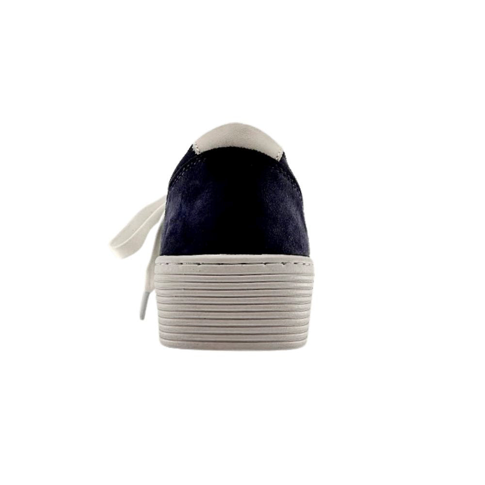 The back view of a navy blue suede sneaker with a cleated white sole on a white background.