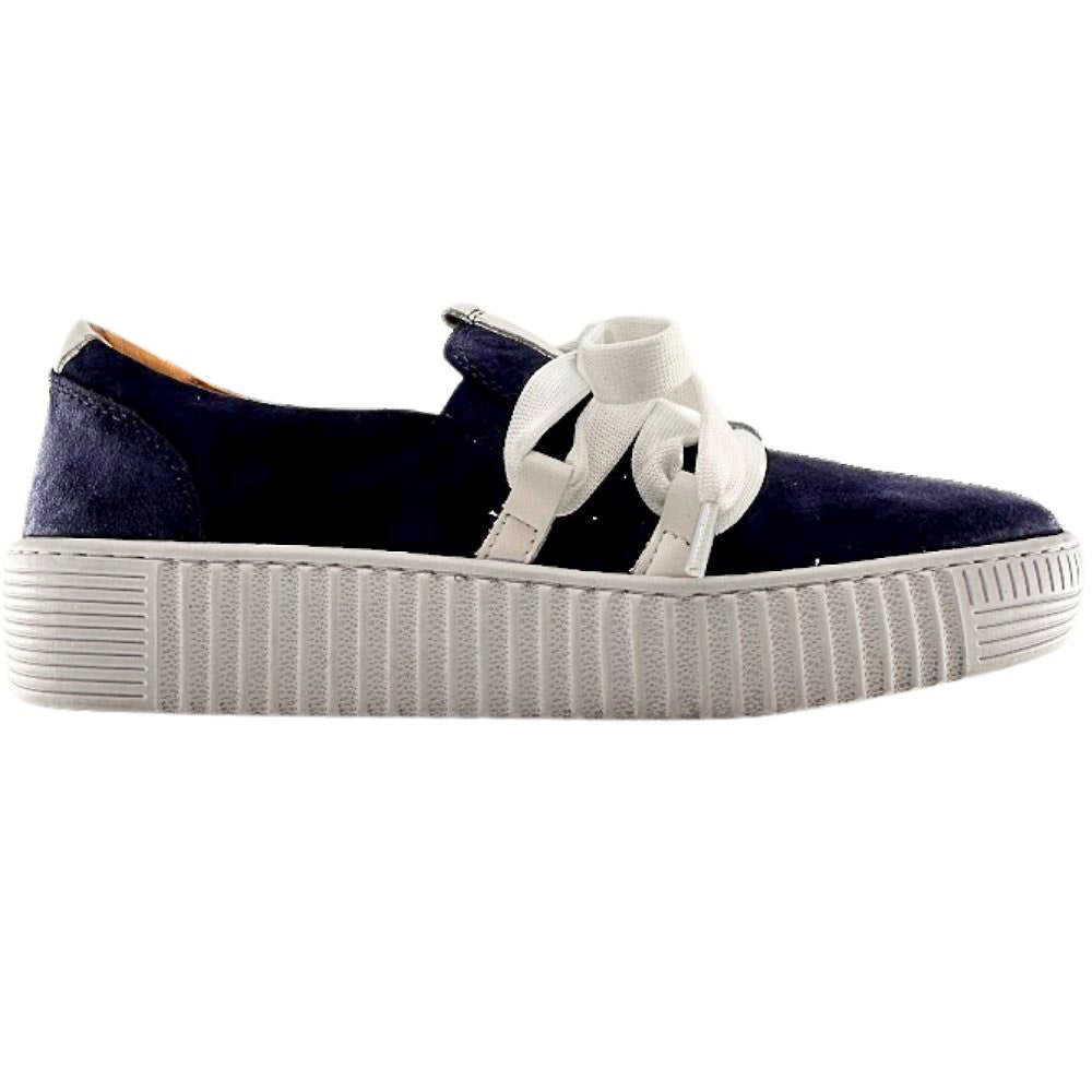 Navy blue suede sneaker with a decorative white lace and cleated sole on a white background.