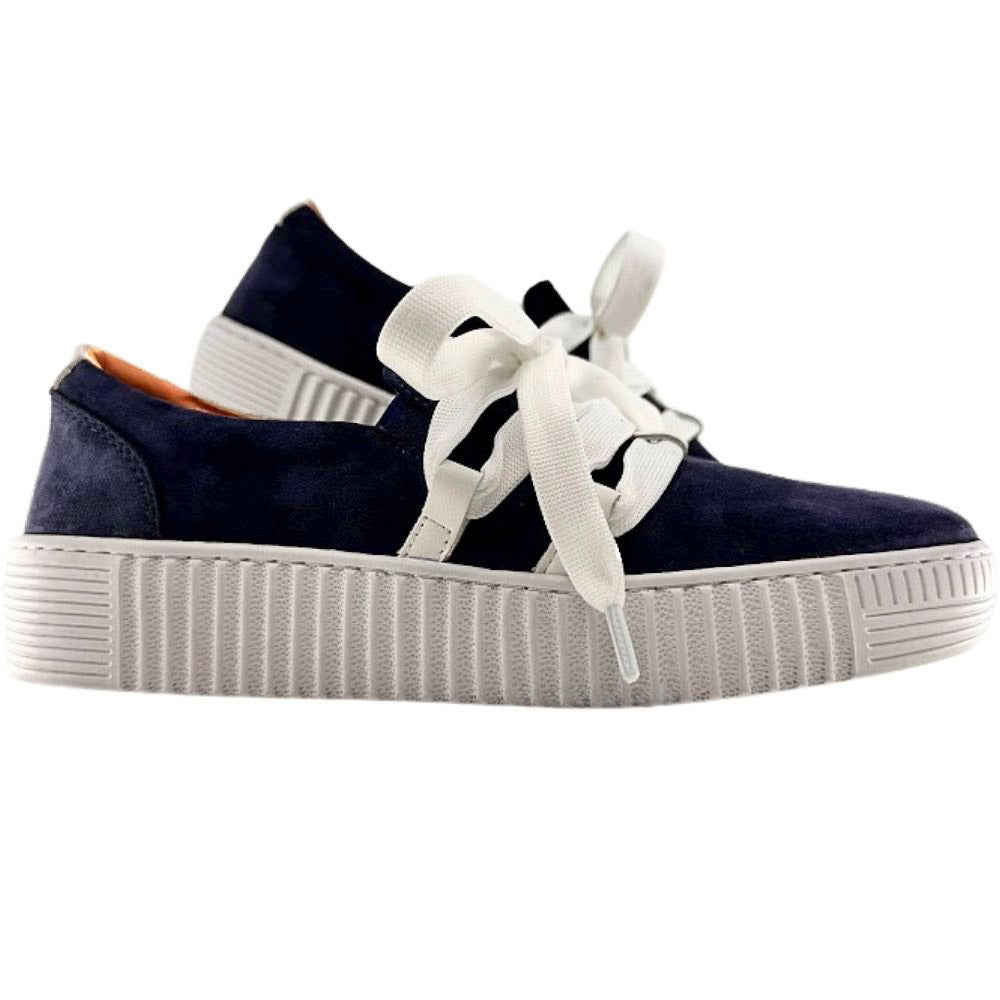 Navy blue suede sneakers with decorative white laces and cleated soles on a white background.