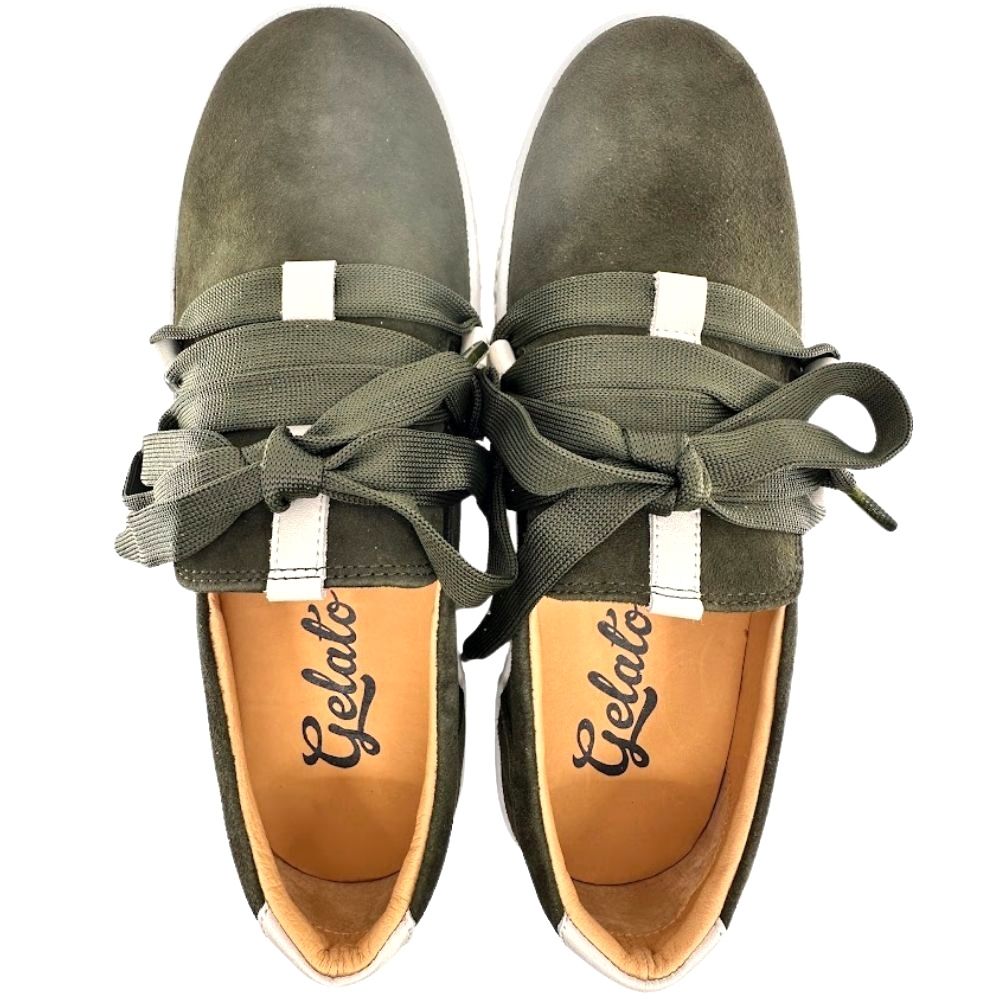 Pair of olive suede leather sneakers with decorative laces from a top-down perspective on a white background.