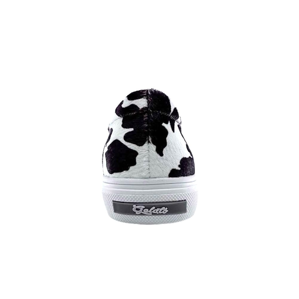 Cow print loafer sneaker with white sole on a white background