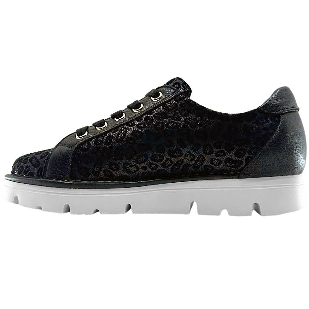 Black sneaker with leopard print pattern on a white background