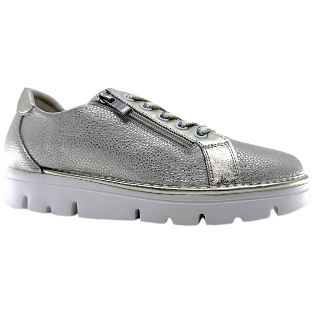 Gold leather sneaker with a white sole on a white background
