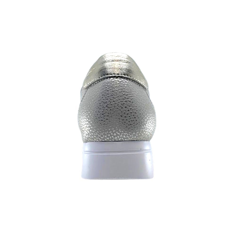 Back of gold leather sneaker on a white background