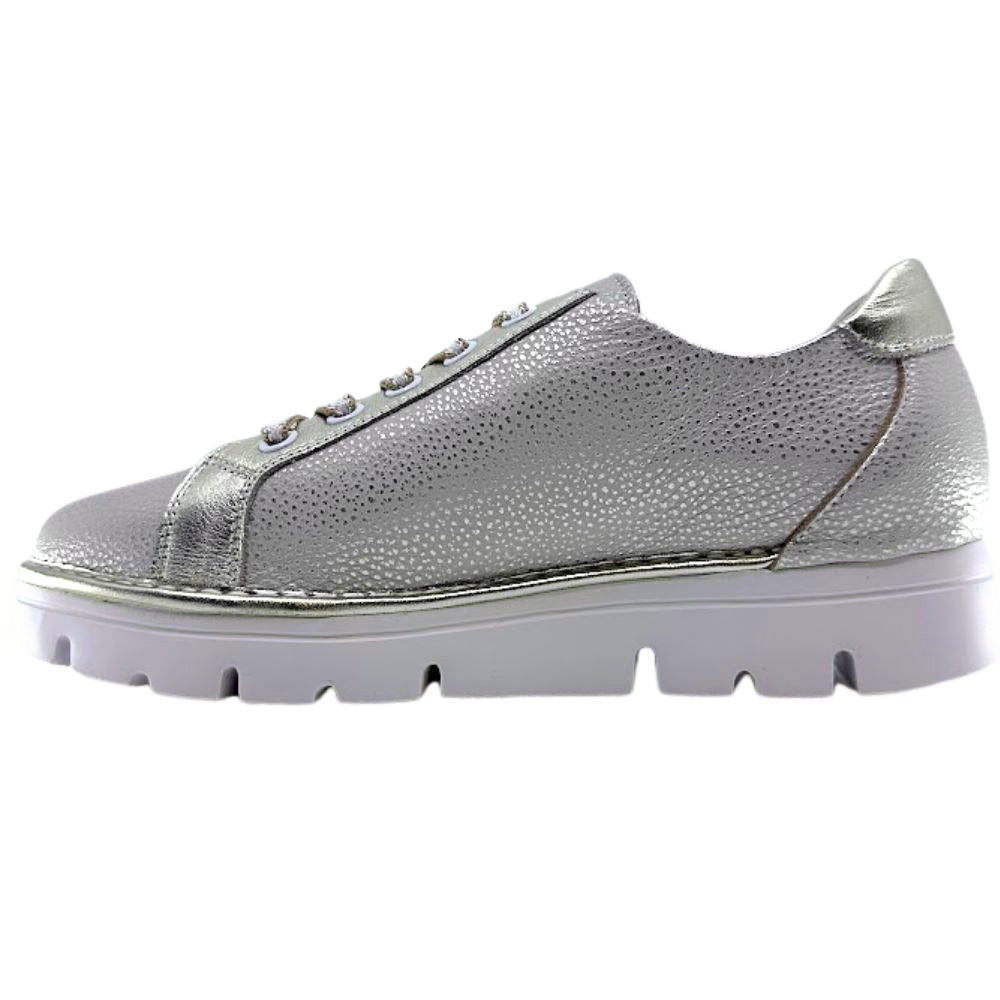 Gold leather sneaker with white sole on a white background