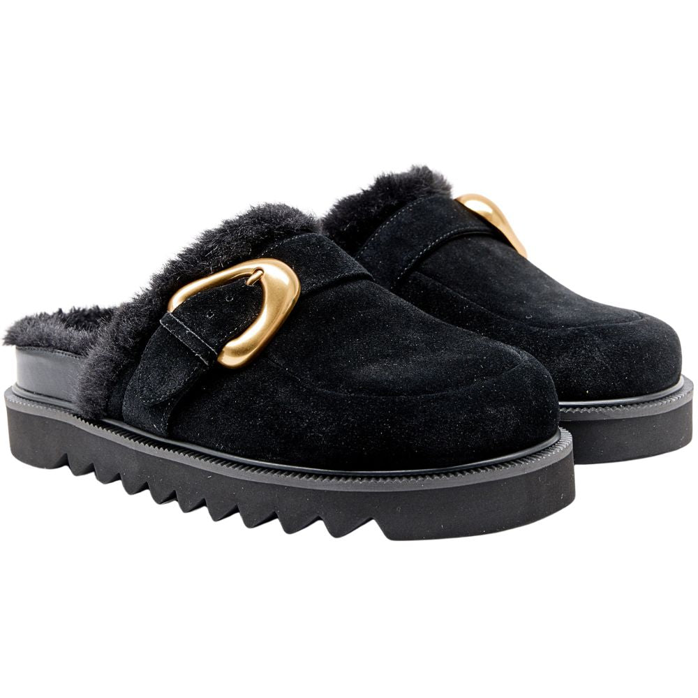 Black suede leather mule with fur lining and gold buckle on a white background