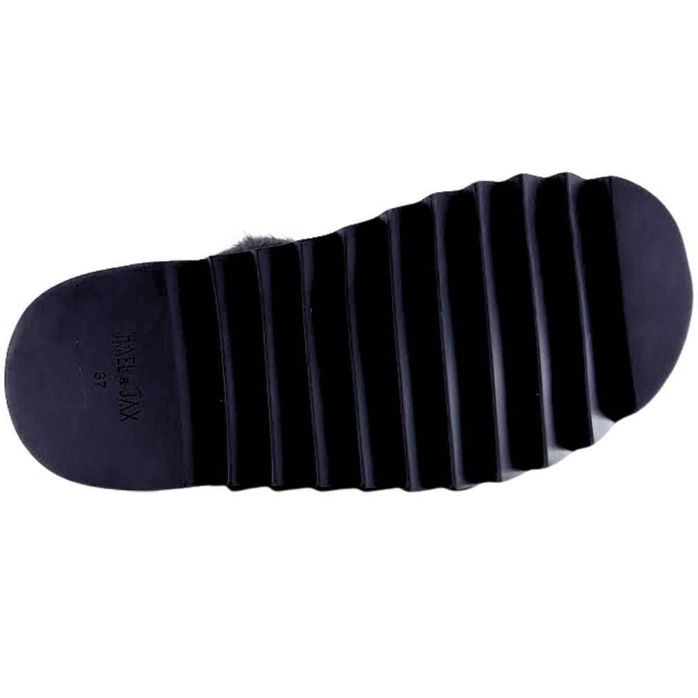 Black sole of a shoe with visible brand name on a white background