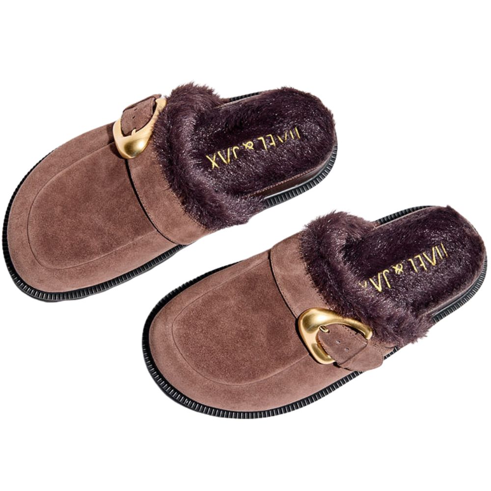 Pair of brown suede mules with fur trim and gold buckle on a white background