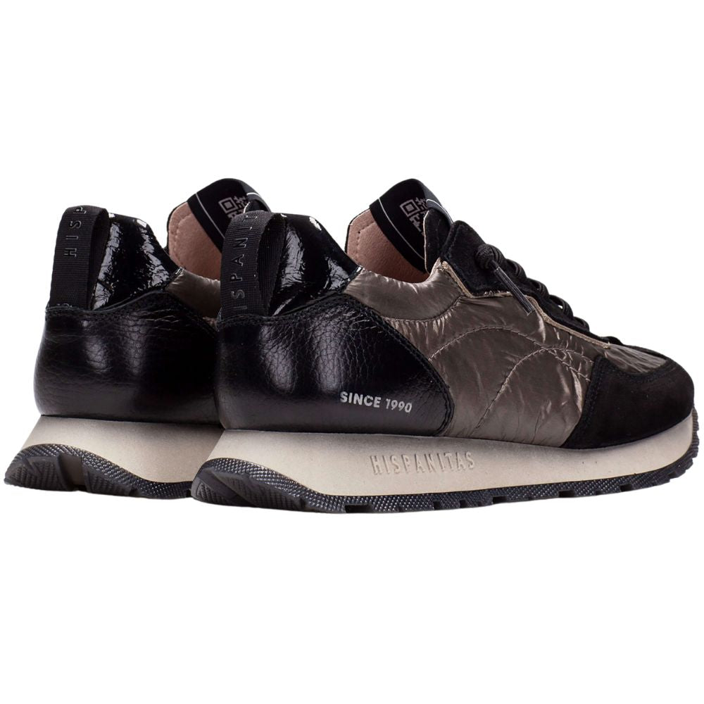 Pair of black and bronze sneakers on a white background