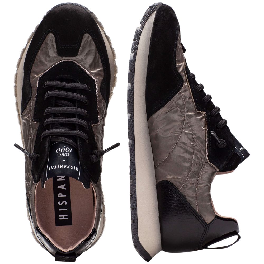 Pair of black and bronze sneakers with visible brand name on a white background