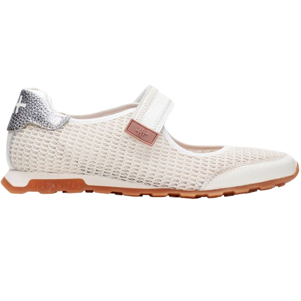 A white mesh and leather Mary Jane shoe with a hook-and-loop strap, a metallic silver textured heel tab, and a brown sole, shown in profile against a white background.