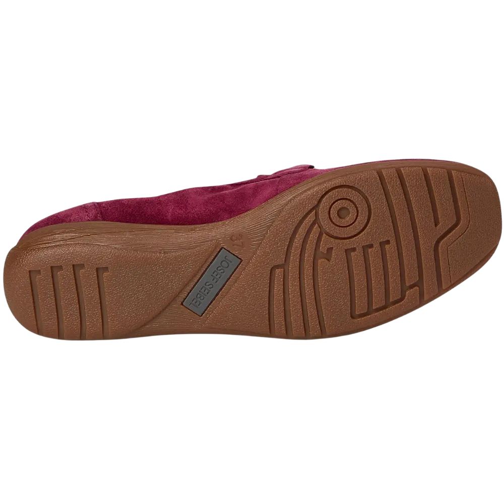 Brown sole of a shoe with a visible brand logo on a white background