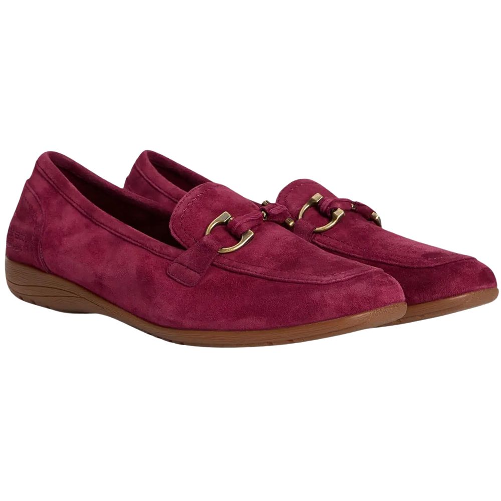 Pair of maroon loafers with gold horse-bit buckles on a white background