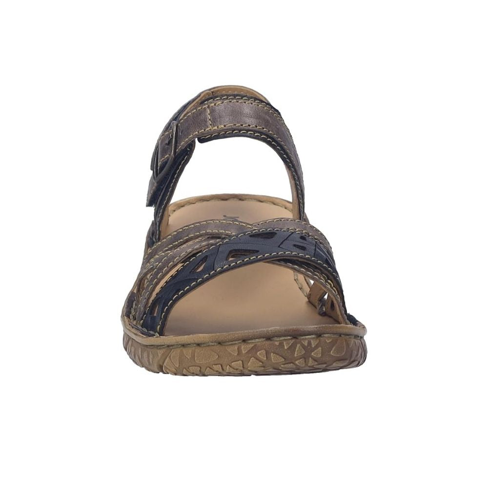 A single women's flat sandal shown from the front on a plain white background. The sandal features dark brown and navy blue woven straps with a tan footbed and a brown textured sole.