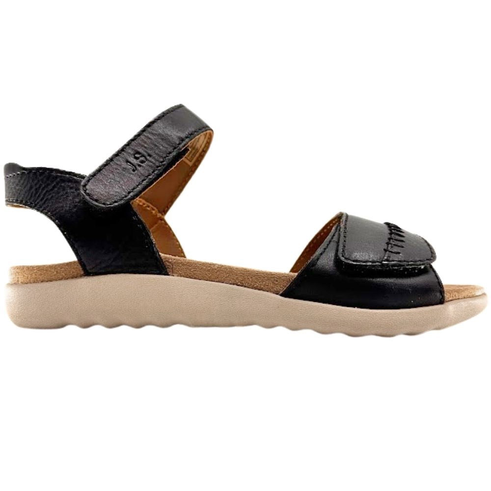 A single black leather sandal with a thick beige sole, shown in a side profile view against a plain white background.