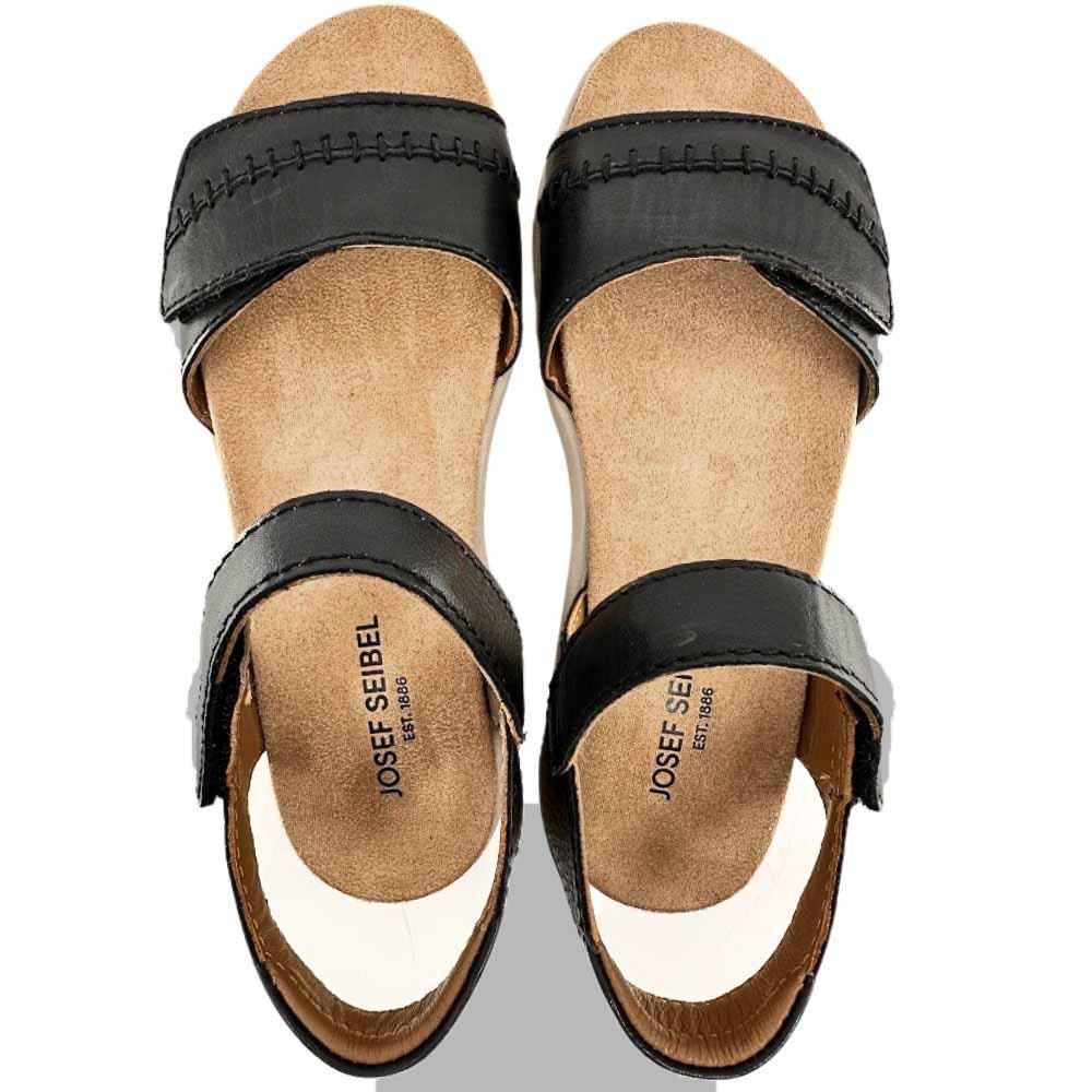 A pair of Josef Seibel black leather slide sandals with tan insoles, shown from a top-down view on a white background.