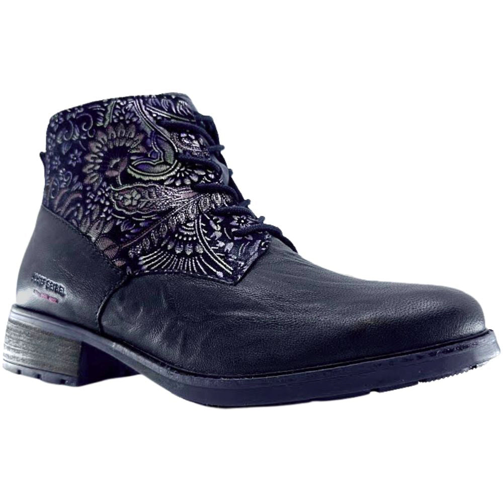 Black boot with intricate patterned design on a white background