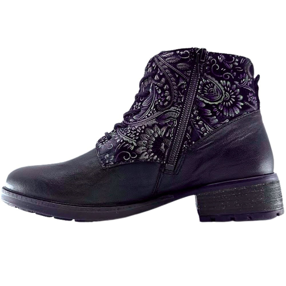 Black boot with an intricate floral pattern on a white background