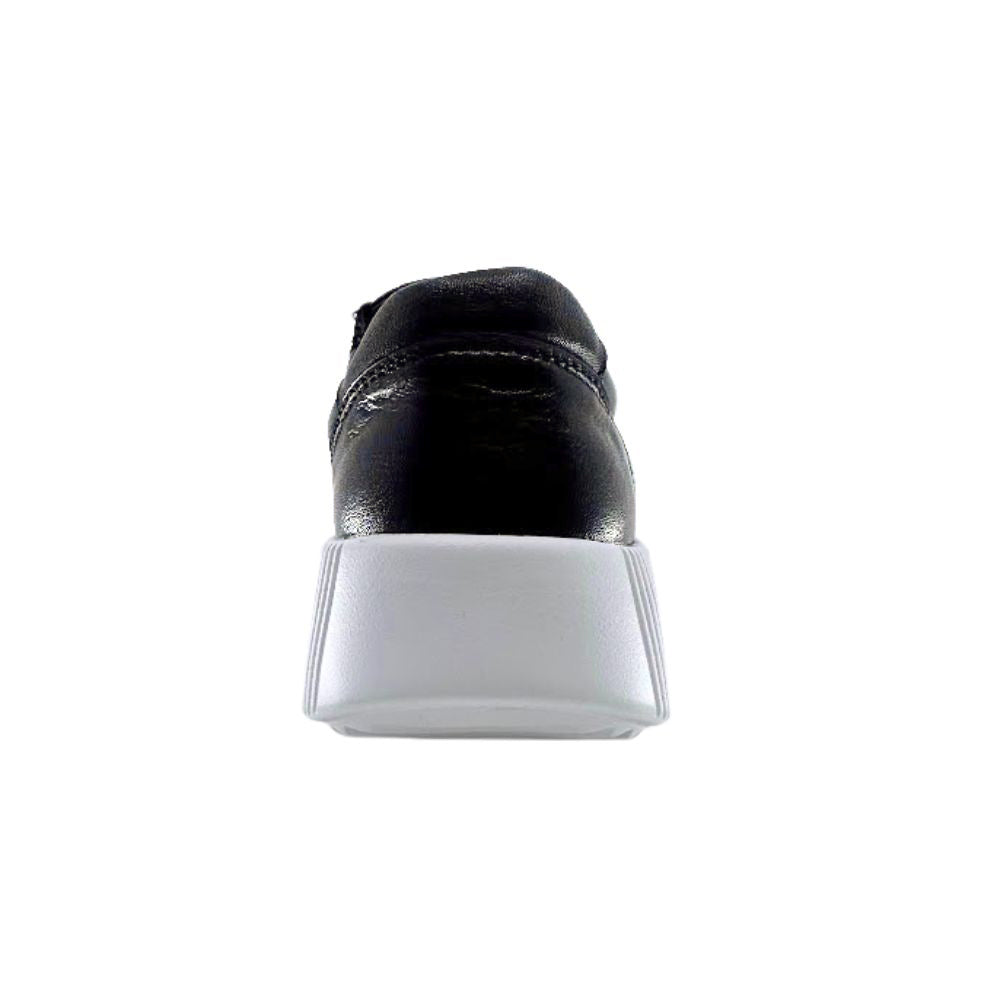 Black shoe with white sole on a white background