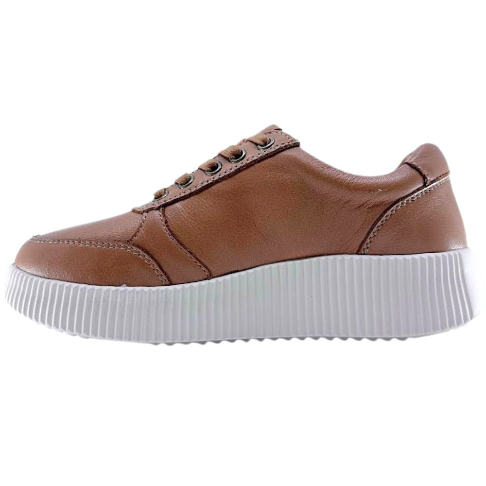 Tan sneaker with white sole on a white background