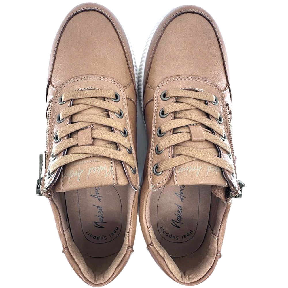 Pair of tan sneakers with laces on a white background
