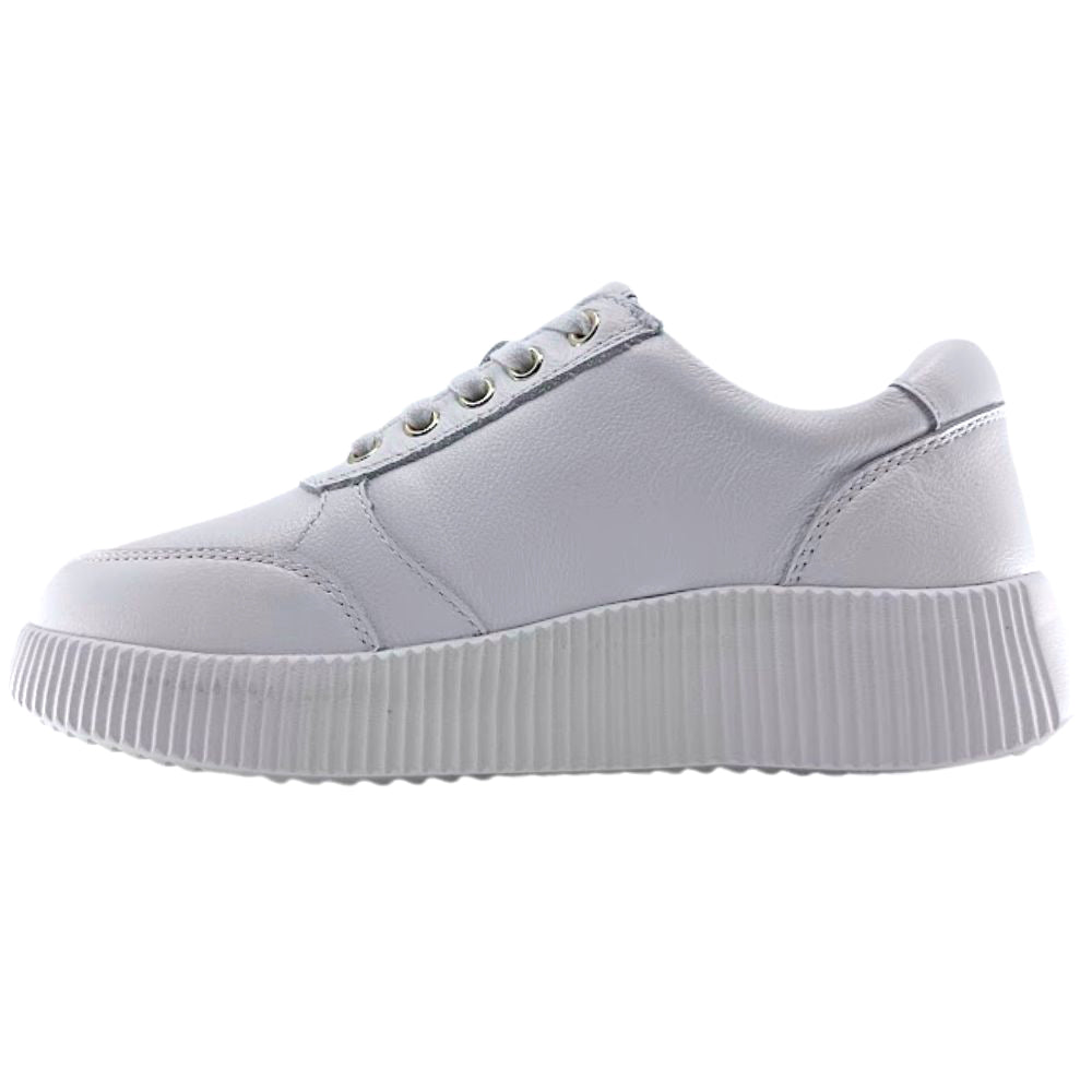 Inside of a white sneaker with a white sole on a white background