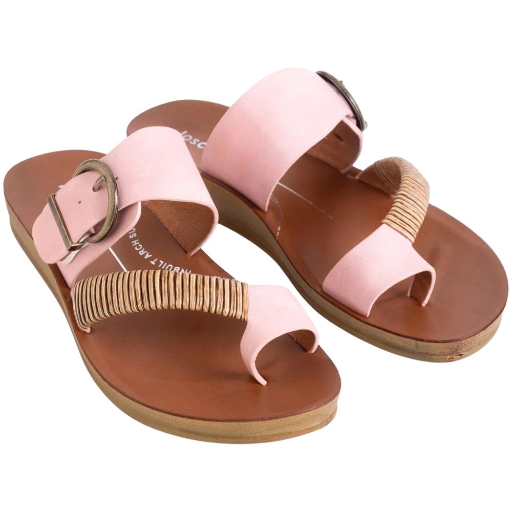 A pair of women's slide sandals in light pink, featuring wide straps with bronze buckles, braided toe straps, and tan soles on a white background.