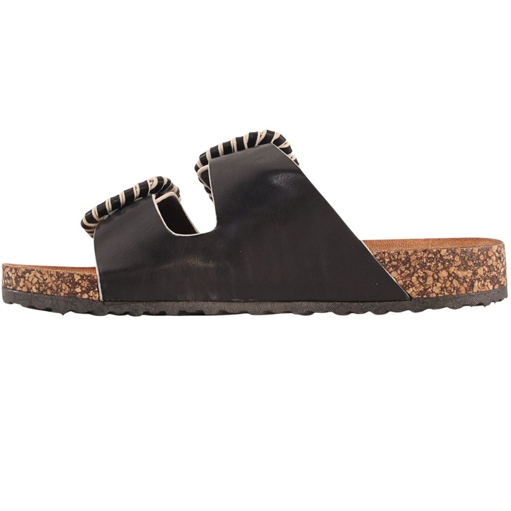 The inside of a  black double-strap slide sandal with decorative braided trim around the straps and a cork-textured footbed, shown on a plain white background.