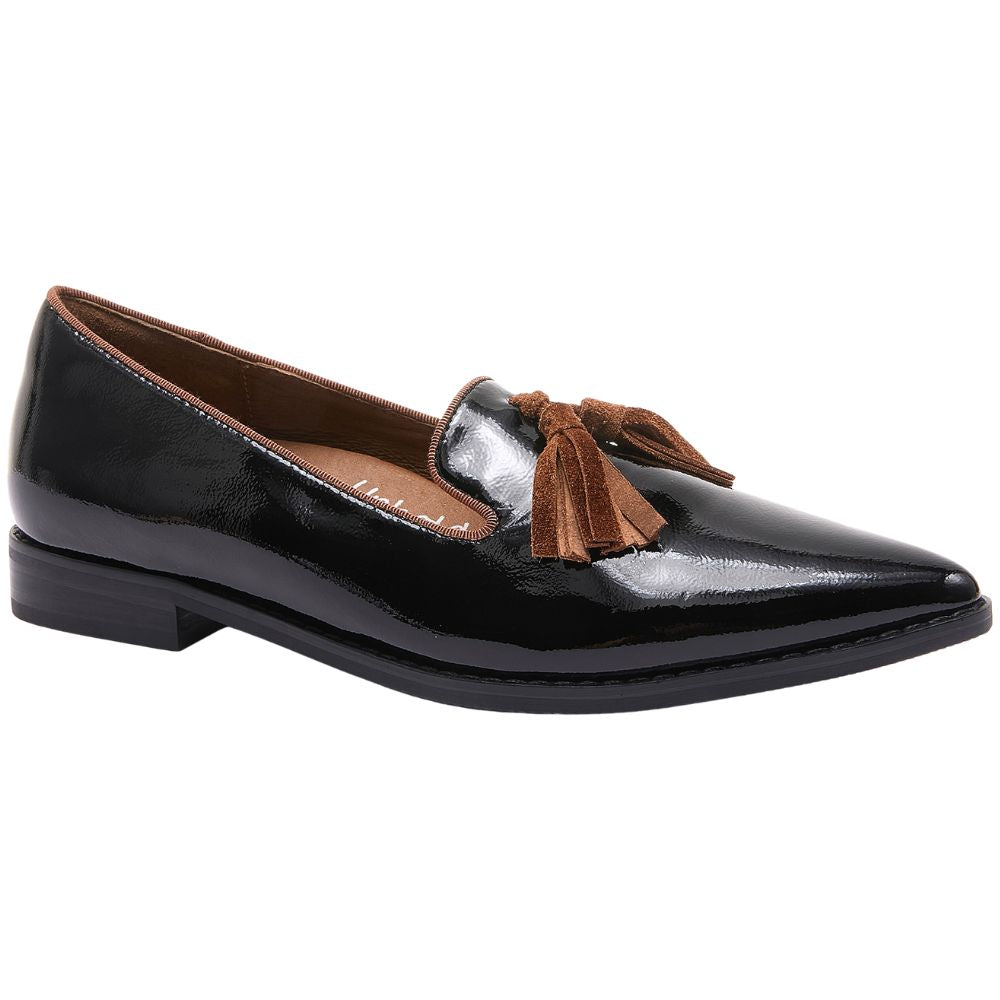 Black patent leather loafer with a brown tassel on a white background