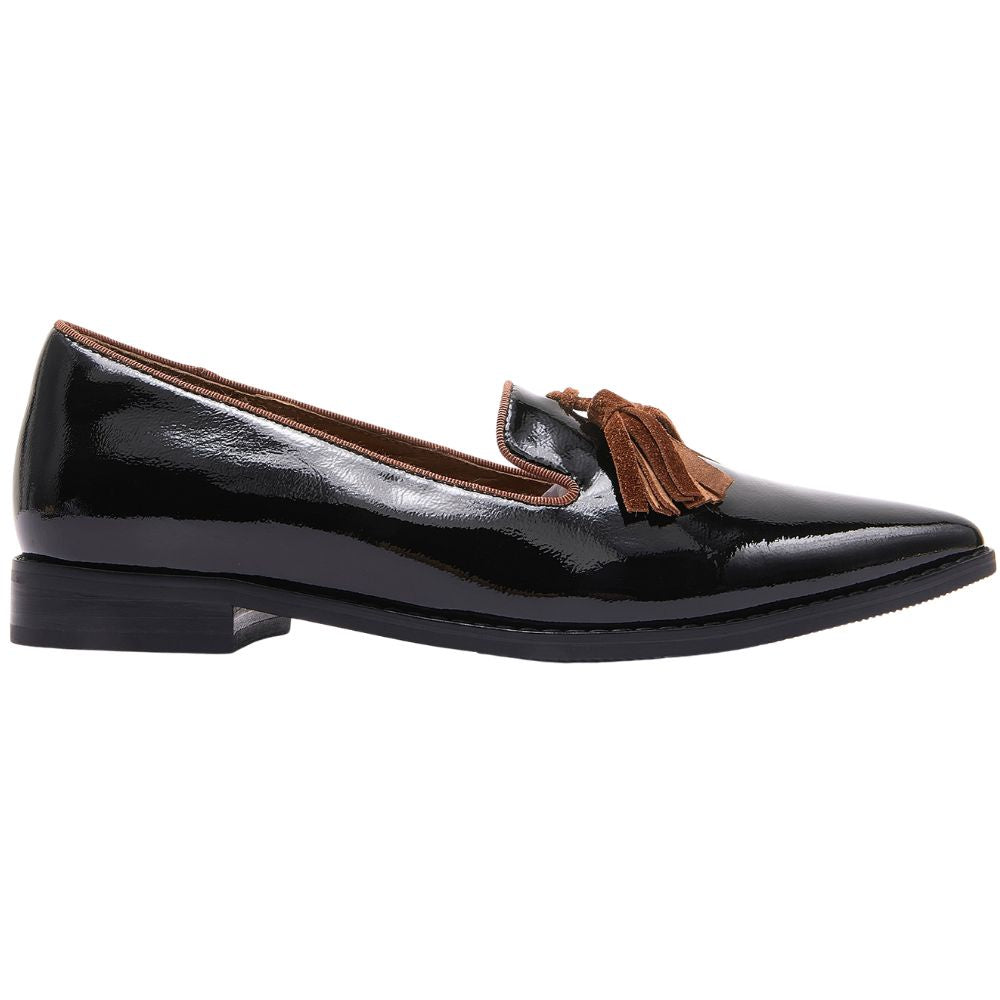 Black patent leather loafer with brown tassel on a white background