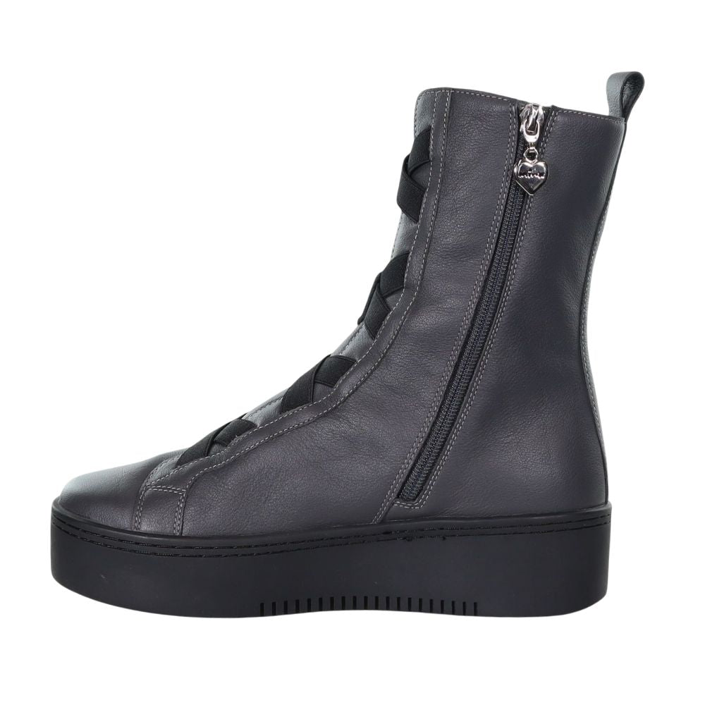 Grey leather boot with black sole and black criss-cross detailing on a white background