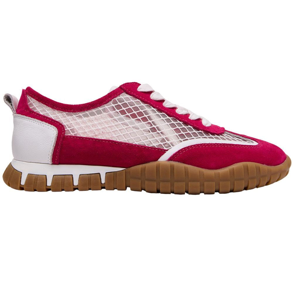A low-top sneaker shown in profile against a white background. The shoe features a vibrant magenta pink suede upper with white mesh panels, white laces, a white midsole, and a brown gum outsole.