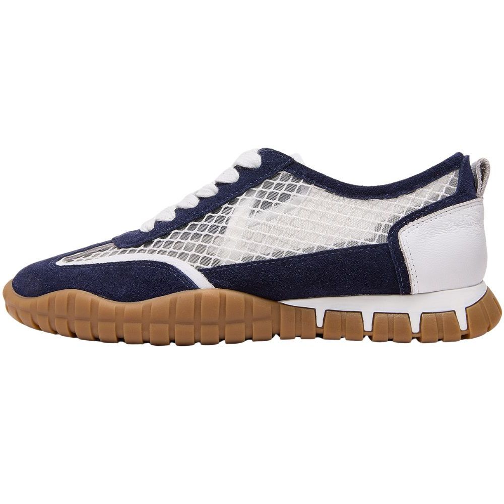 A low-top sneaker shown in profile against a white background. The shoe features navy blue suede overlays, a white mesh side panel, white laces, a white heel counter, and a brown gum rubber sole.