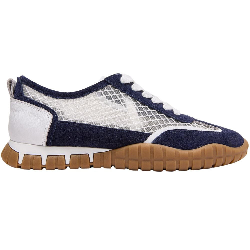 A low-top sneaker shown in profile against a white background. The shoe features navy blue suede panels, a white mesh upper, white laces, a white heel counter, and a brown gum rubber sole.