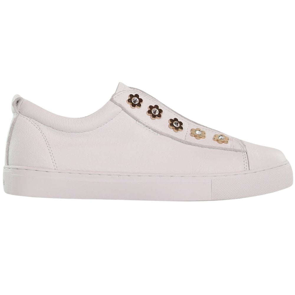 A white slip-on sneaker featuring decorative gold flower details, set against a plain white background.