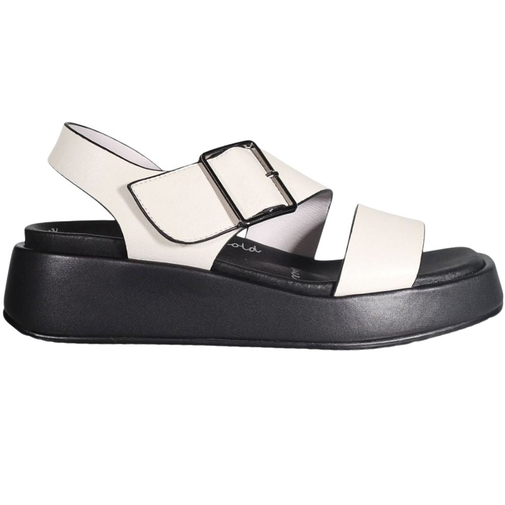 A single platform sandal with off-white straps and a thick black platform sole, shown in a side profile on a white background.