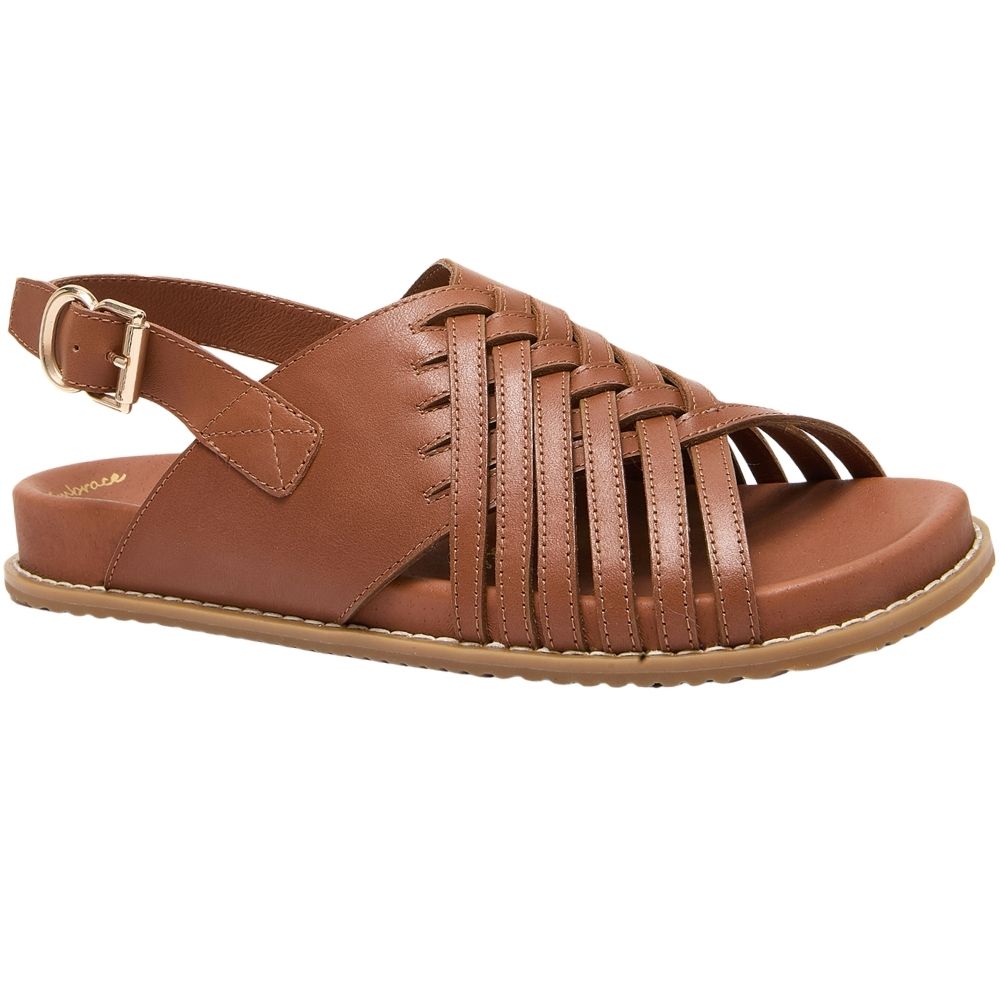 A brown leather strappy sandal with a braided front strap, adjustable ankle strap with a gold-tone buckle, and a flat sole, shown against a plain white background.