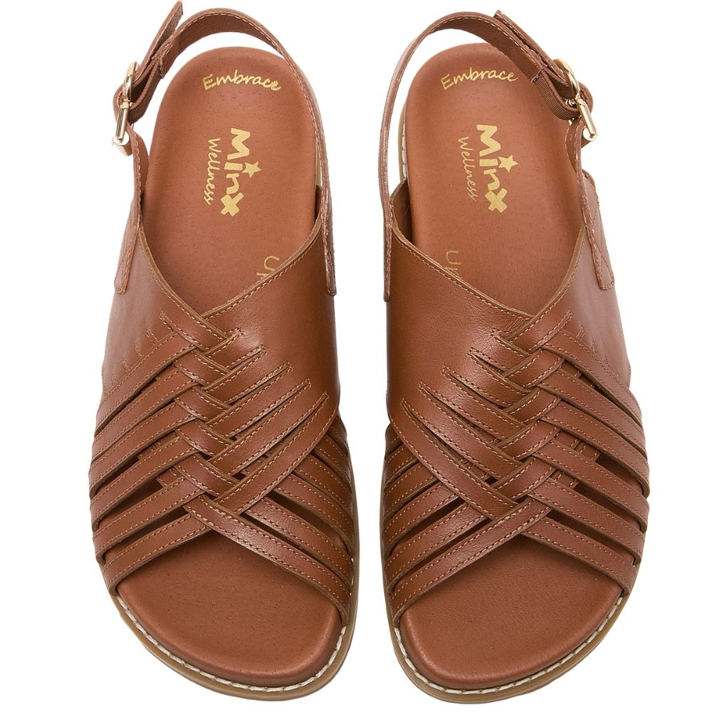 A pair of brown leather strappy sandals with a braided crisscross pattern across the toes, shown from a top-down view on a white background. The insoles feature gold branding for 'Embrace' and 'Minx'.