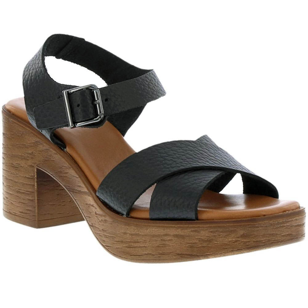 A black leather platform sandal with crisscross straps, an adjustable ankle strap with a silver buckle, and a chunky brown wooden block heel and platform sole, shown against a plain white background.