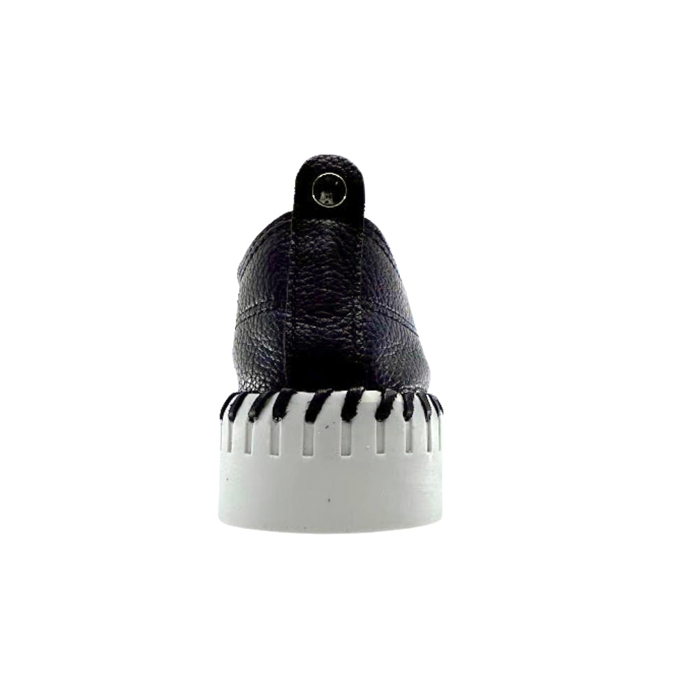 Back of black leather sneaker with a white sole on a white background
