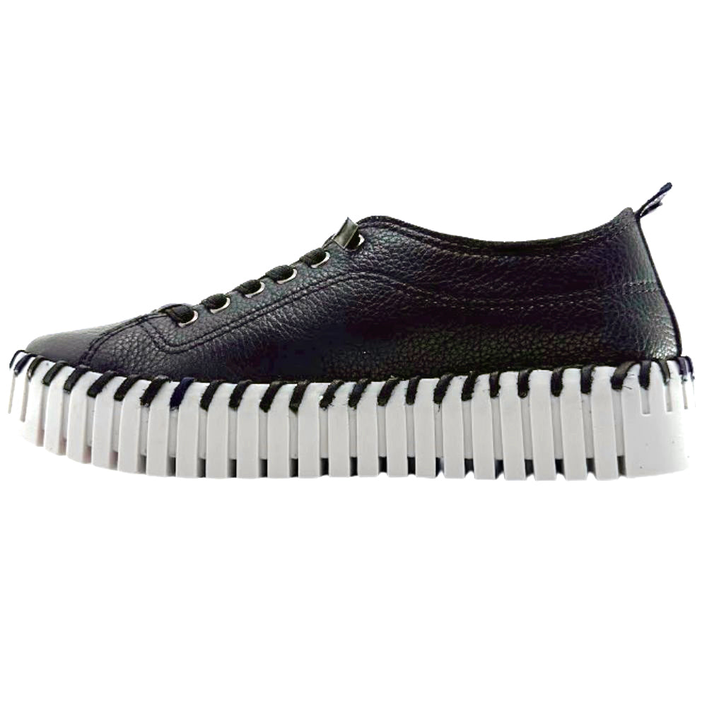 Black leather sneaker with a unique sole design on a white background