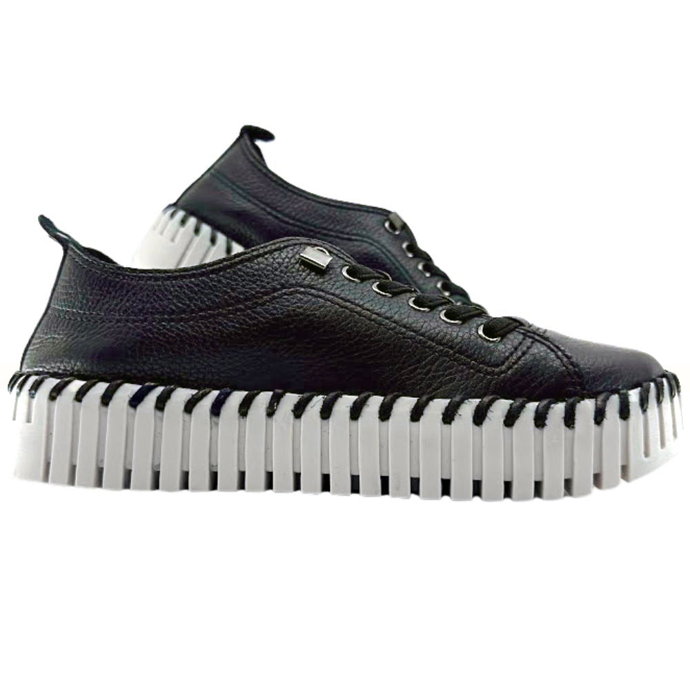 Black sneakers with white soles on a white background